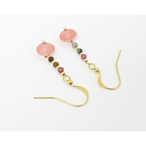 645 - A pair of drop earrings set with tourmaline. Approx. 1