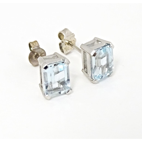 647 - A pair of 18ct white gold stud earrings set with aquamarine