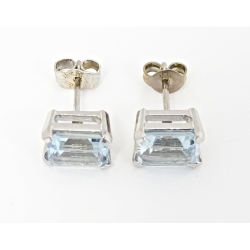 647 - A pair of 18ct white gold stud earrings set with aquamarine