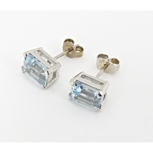 647 - A pair of 18ct white gold stud earrings set with aquamarine