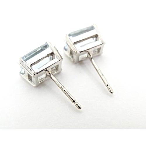 647 - A pair of 18ct white gold stud earrings set with aquamarine