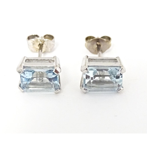 647 - A pair of 18ct white gold stud earrings set with aquamarine