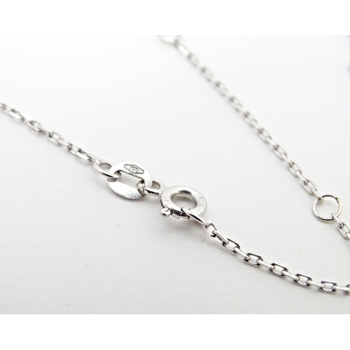 652 - An 18ct white gold necklace set with pearl beads. Approx. 36