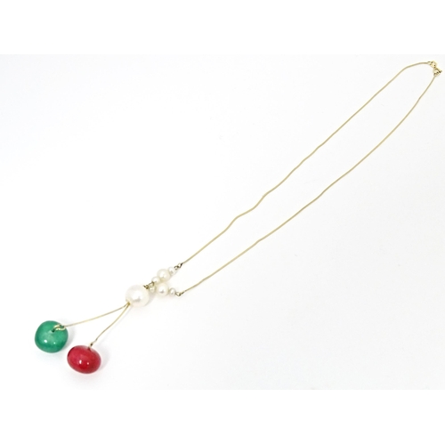 653 - A 14ct gold necklace set with pearl, green and red stone beads. Approx. 17