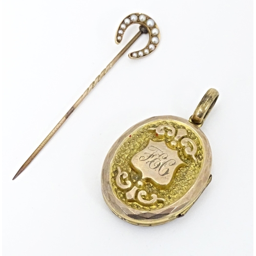 662 - A gilt metal oval locket of pendant form titled 'Regard' opening to reveal hand painted miniature wi... 