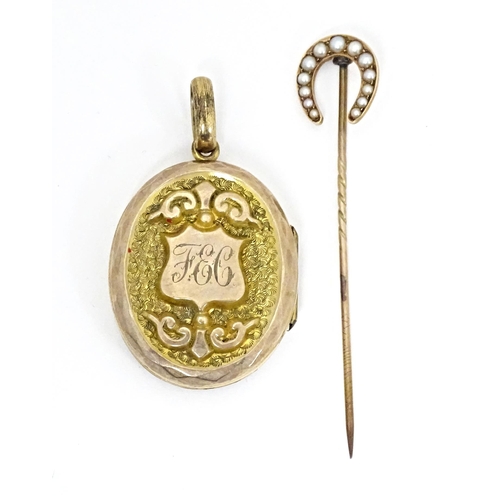 662 - A gilt metal oval locket of pendant form titled 'Regard' opening to reveal hand painted miniature wi... 