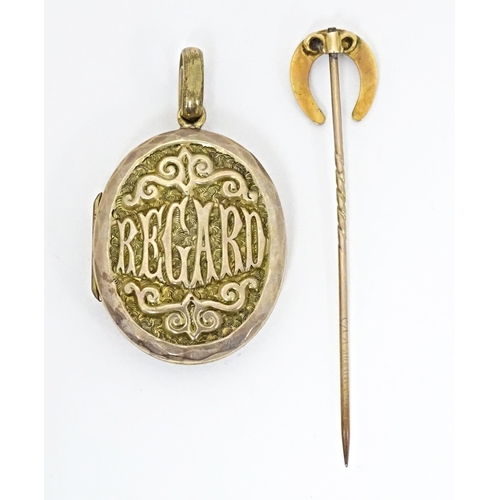 662 - A gilt metal oval locket of pendant form titled 'Regard' opening to reveal hand painted miniature wi... 