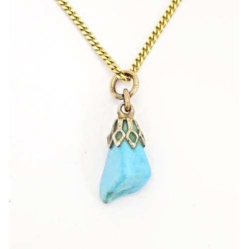 665 - A 9ct gold necklace with turquoise drop pendant. Chain approx. 20