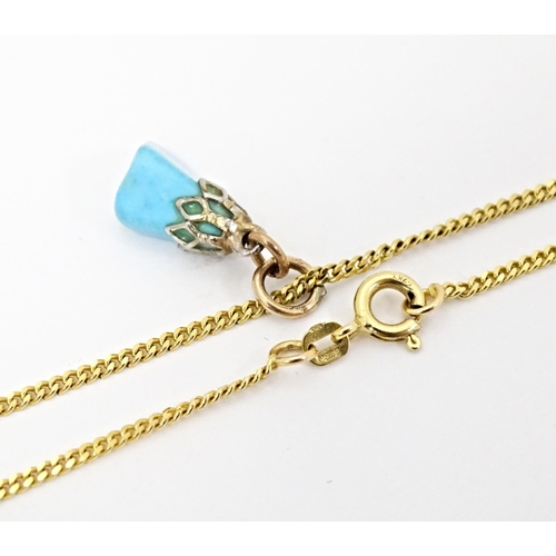 665 - A 9ct gold necklace with turquoise drop pendant. Chain approx. 20