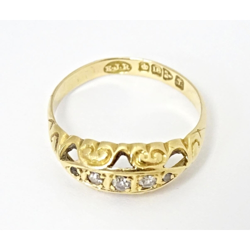 573 - An 18ct gold gypsy ring set with diamonds, hallmarked Chester 1919. Ring size approx. K 1/2