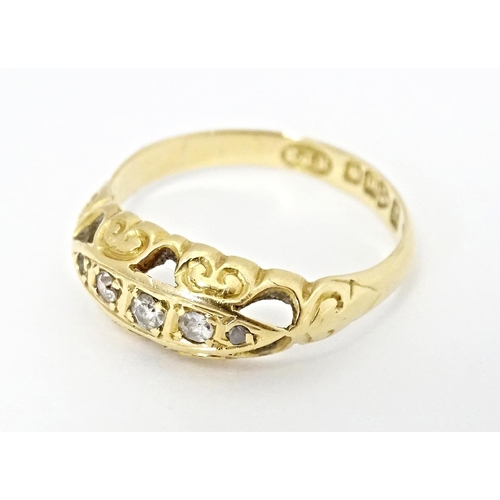 573 - An 18ct gold gypsy ring set with diamonds, hallmarked Chester 1919. Ring size approx. K 1/2