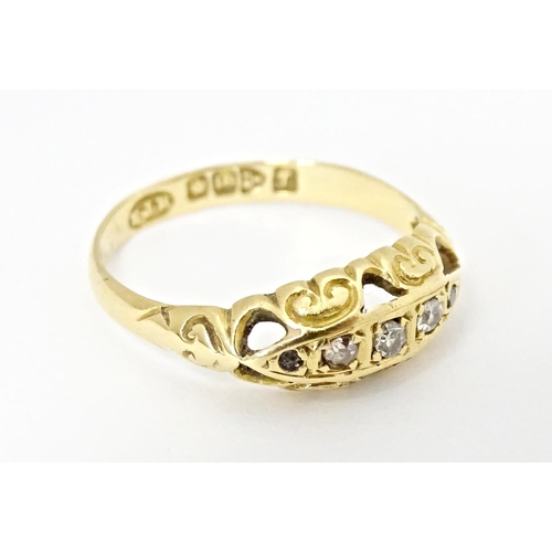 573 - An 18ct gold gypsy ring set with diamonds, hallmarked Chester 1919. Ring size approx. K 1/2