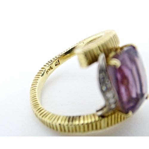 579 - An 18ct gold cocktail ring set with central amethyst flanked by diamonds. Ring size approx. O