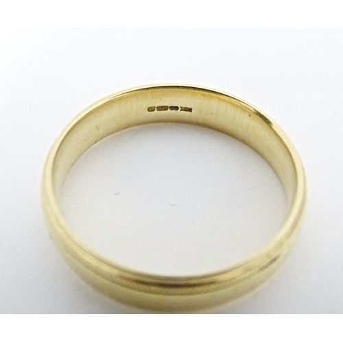 584 - An 18ct gold ring. Ring size approx. S