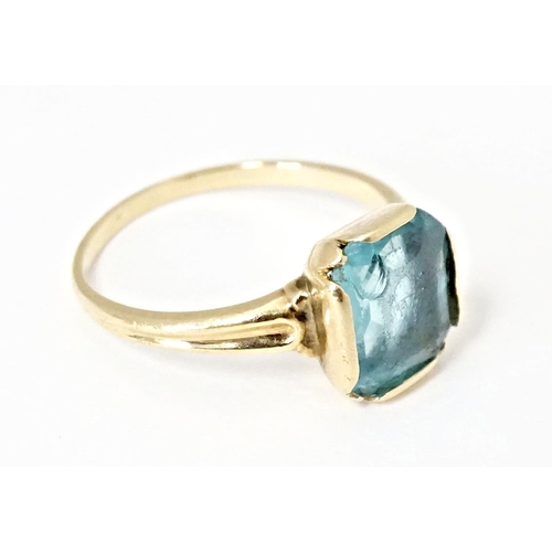 598 - A Continental Art Deco style 10k gold ring set with central blue stone. Ring size approx. N 1/2