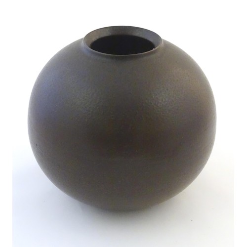 50A - A Japanese vase of globular form with a drip glaze. Approx. 10 3/4