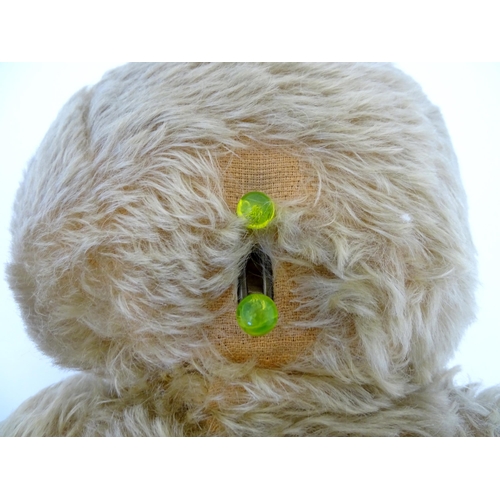 824 - A 20thC mohair teddy bear with moving mouth mechanism, stitched nose, pad paws and articulated limbs... 