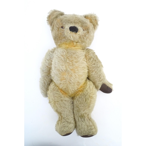 824 - A 20thC mohair teddy bear with moving mouth mechanism, stitched nose, pad paws and articulated limbs... 