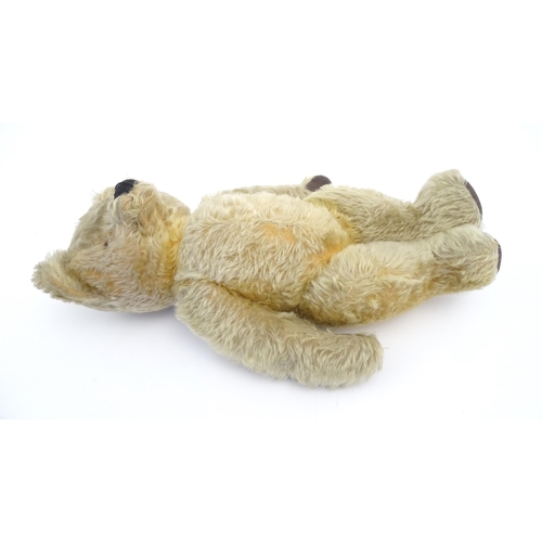 824 - A 20thC mohair teddy bear with moving mouth mechanism, stitched nose, pad paws and articulated limbs... 