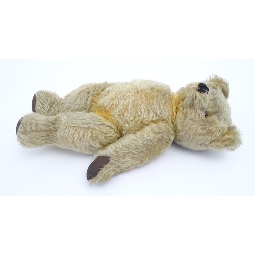 824 - A 20thC mohair teddy bear with moving mouth mechanism, stitched nose, pad paws and articulated limbs... 