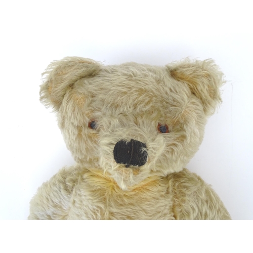 824 - A 20thC mohair teddy bear with moving mouth mechanism, stitched nose, pad paws and articulated limbs... 