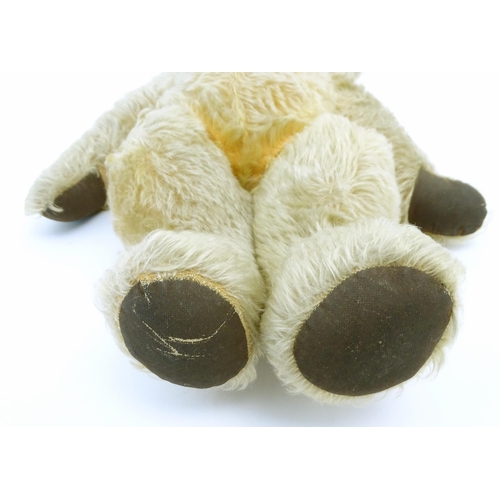 824 - A 20thC mohair teddy bear with moving mouth mechanism, stitched nose, pad paws and articulated limbs... 