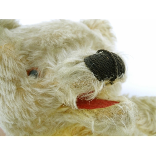 824 - A 20thC mohair teddy bear with moving mouth mechanism, stitched nose, pad paws and articulated limbs... 