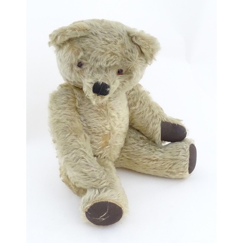 824 - A 20thC mohair teddy bear with moving mouth mechanism, stitched nose, pad paws and articulated limbs... 