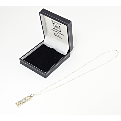 667 - A silver pendant and chain, the pendant inspired by the designs of Mackintosh. The chain 18