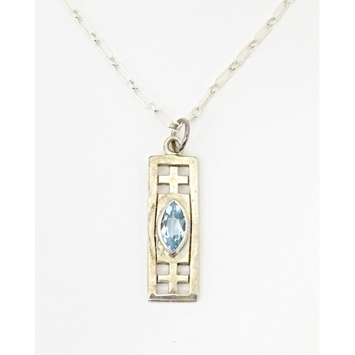 667 - A silver pendant and chain, the pendant inspired by the designs of Mackintosh. The chain 18