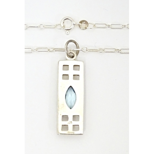 667 - A silver pendant and chain, the pendant inspired by the designs of Mackintosh. The chain 18