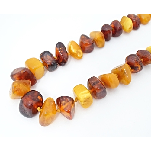 672 - An amber bead necklace of graduated beads. Approx 25