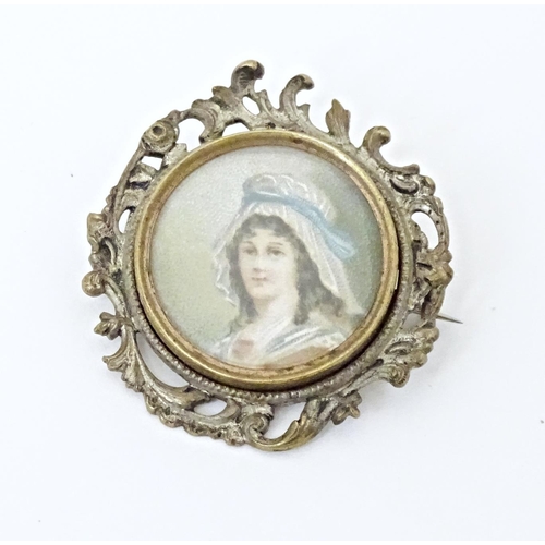 676 - A late 19thC / early 20thC brooch set with watercolour portrait to centre depicting a lady wearing a... 