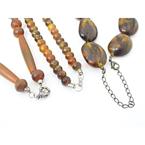 685 - Three assorted bead necklaces with amber coloured beads. Longest approx 30