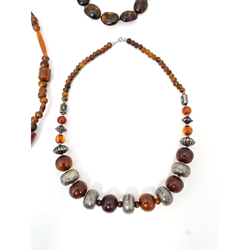 685 - Three assorted bead necklaces with amber coloured beads. Longest approx 30