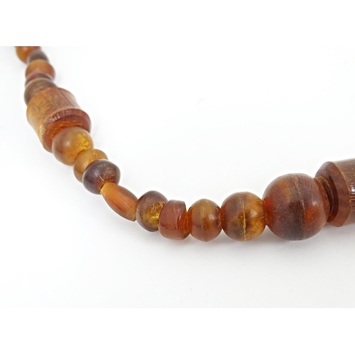 685 - Three assorted bead necklaces with amber coloured beads. Longest approx 30