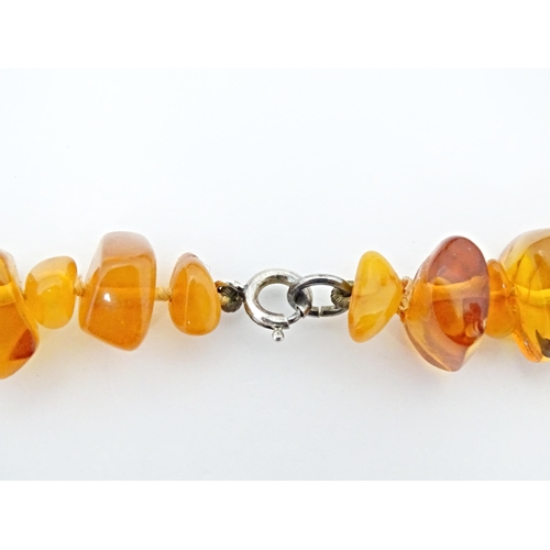 686 - A vintage necklace of graduated amber coloured beads. Approx 18