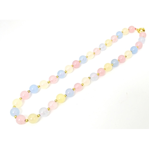 689 - A bead necklace of pink, blue and cream, coloured tourmaline beads. Approx 18