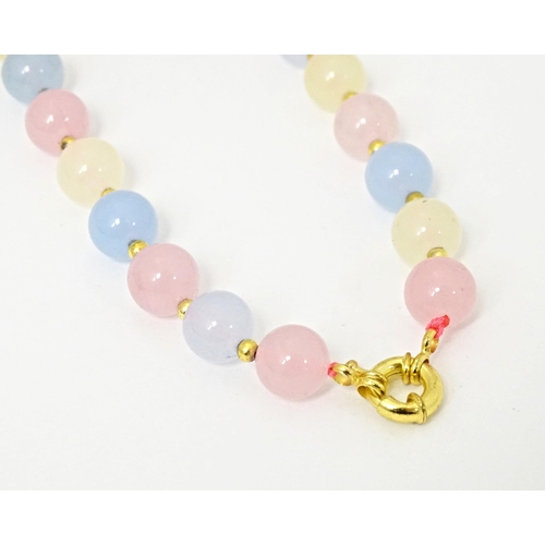 689 - A bead necklace of pink, blue and cream, coloured tourmaline beads. Approx 18