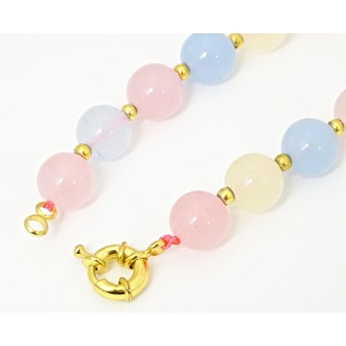 689 - A bead necklace of pink, blue and cream, coloured tourmaline beads. Approx 18