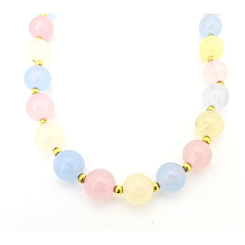 689 - A bead necklace of pink, blue and cream, coloured tourmaline beads. Approx 18