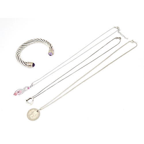 691 - Assorted silver and white metal jewellery comprising a bangle set with amethyst and assorted pendant... 