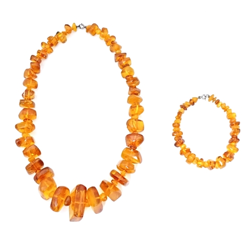 686 - A vintage necklace of graduated amber coloured beads. Approx 18