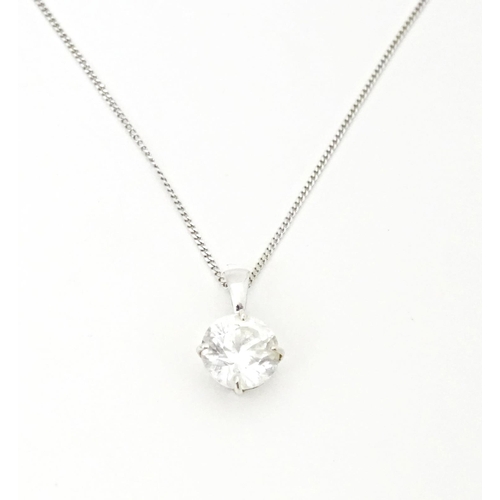 687 - A 9ct white gold chain with pendant set with white stone. Chain approx. 18