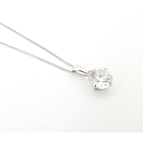 687 - A 9ct white gold chain with pendant set with white stone. Chain approx. 18