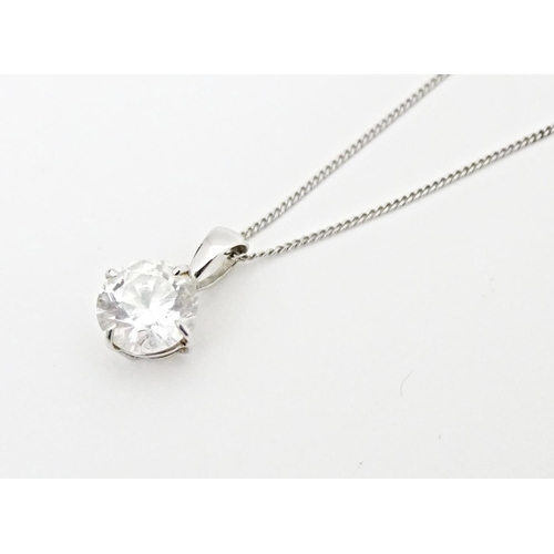 687 - A 9ct white gold chain with pendant set with white stone. Chain approx. 18