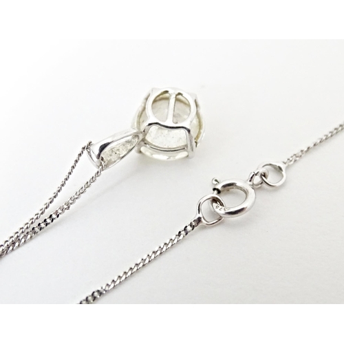 687 - A 9ct white gold chain with pendant set with white stone. Chain approx. 18