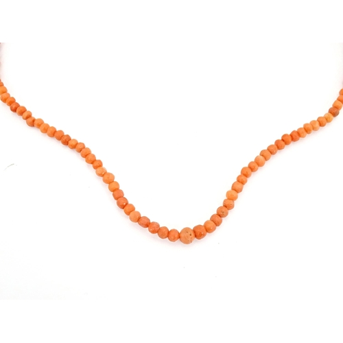 688 - A small coral bead necklace approx 14