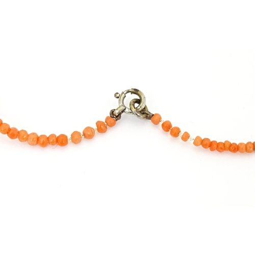 688 - A small coral bead necklace approx 14