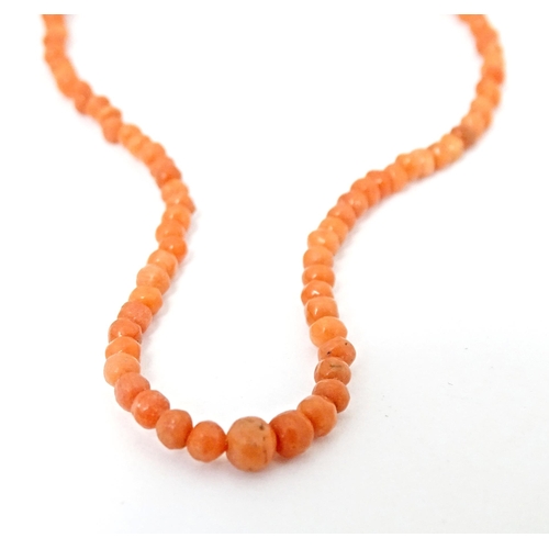 688 - A small coral bead necklace approx 14